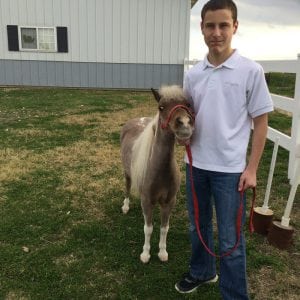 Kameron and miniature horse